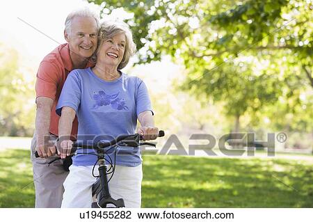 Stock Image - Senior couple on a bicycle. Fotosearch