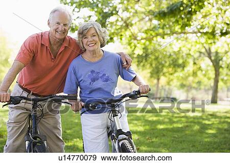Senior couple on bicycles View Large Photo Image Stock Photo - Senior couple on bicycles. Fotosearch