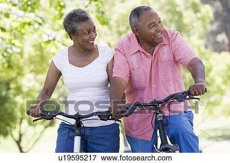 Stock Photo - Senior couple on bicycles. Fotosearch