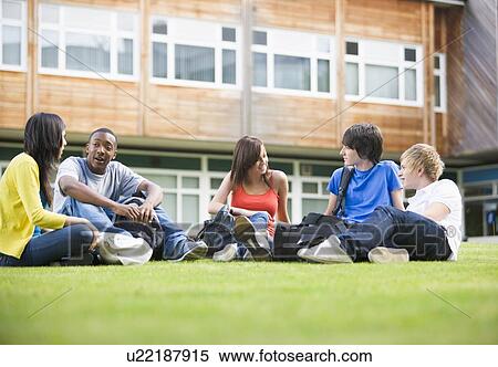 Five students sitting outdoors on lawn talking View Large Photo Image Stock Photography - Five students sitting outdoors on lawn talking. Fotosearch
