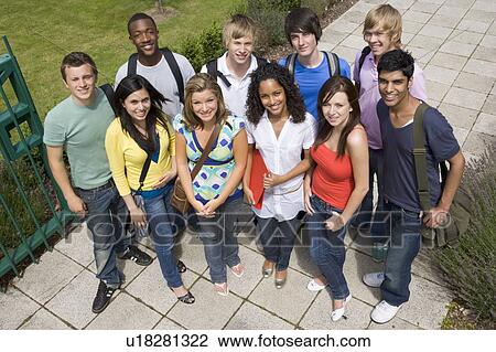 Group of students outdoors looking at camera smiling View Large Photo Image Stock Image - Group of students outdoors looking at camera smiling. Fotosearch