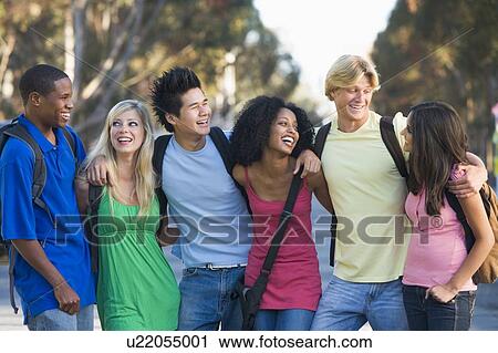 Six people outdoors standing arm in arm together (selective focus) View Large Photo Image Stock Image - Six people outdoors standing arm in arm together (selective focus). Fotosearch