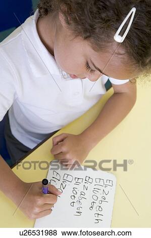 Stock Photo - Student in class learning spelling (selective focus). Fotosearch