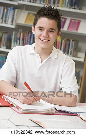 Student writing and studying View Large Photo Image Stock Image - Student writing and studying. Fotosearch