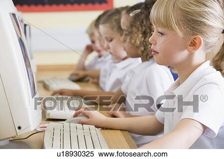 Students in class at computer terminals (depth of field) View Large Photo Image Stock Photography - Students in class at computer terminals (depth of field). Fotosearch