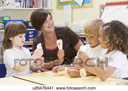 Students in class with teacher learning numbers View Large Photo Image Stock Image - Students in class with teacher learning numbers. Fotosearch