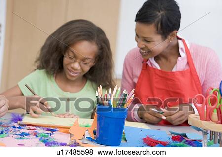 Teacher and student in art class (selective focus) View Large Photo Image Stock Photo - Teacher and student in art class (selective focus). Fotosearch