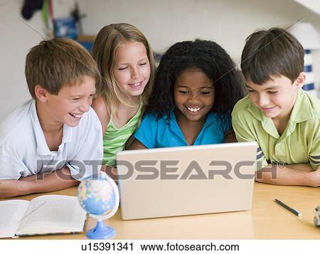 Group Of Young Children Doing Their Homework On A Laptop View Large Photo Image Stock Image - Group Of Young Children Doing Their Homework On A Laptop. Fotosearch