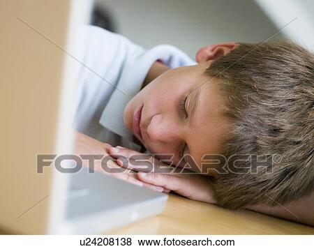 Young Boy Asleep By His Laptop View Large Photo Image Stock Photo - Young Boy Asleep By His Laptop. Fotosearch