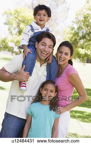 Family outdoors smiling View Large Photo Image Stock Image - Family outdoors smiling. Fotosearch