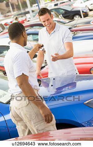 Man shopping for a new car View Large Photo Image Stock Image - Man shopping for a new car. Fotosearch