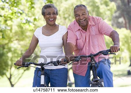 Senior couple on bicycles View Large Photo Image Stock Image - Senior couple on bicycles. Fotosearch