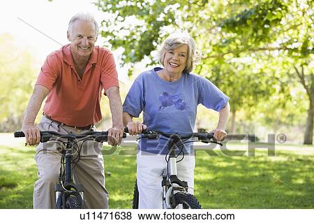 Senior couple on bicycles View Large Photo Image Stock Photo - Senior couple on bicycles. Fotosearch