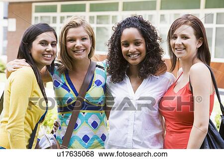 Stock Photo - Group of students outdoors looking at camera smiling. Fotosearch
