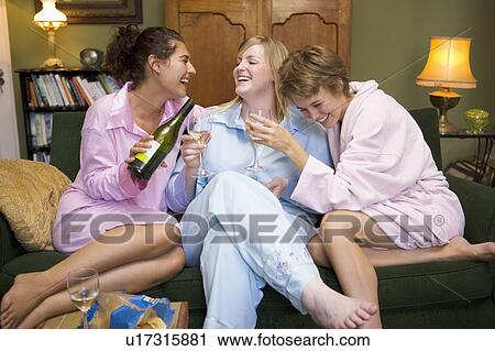 Three woman in night clothes sitting at home drinking wine View Large Photo Image Stock Image - Three woman in night clothes sitting at home drinking wine. Fotosearch