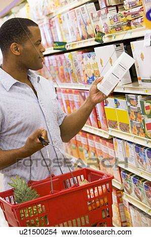 Man shopping at grocery store View Large Photo Image Picture - Man shopping at grocery store. Fotosearch