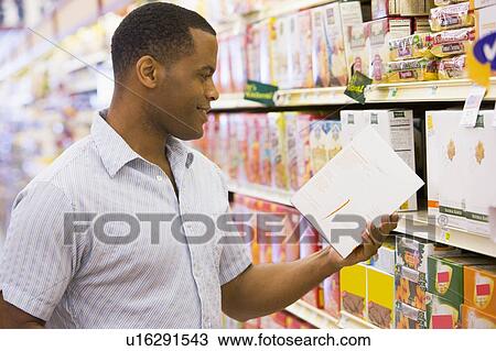 Man shopping at grocery store View Large Photo Image Stock Image - Man shopping at grocery store. Fotosearch