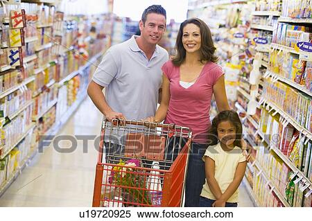 Mother and father with young daughter shopping at the grocery store. View Large Photo Image Stock Photography - Mother and father with young daughter shopping at the grocery store.. Fotosearch