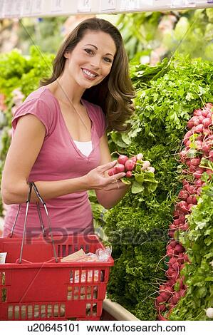 Woman shopping for beets at a grocery store View Large Photo Image Stock Image - Woman shopping for beets at a grocery store. Fotosearch