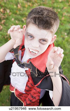 Young boy outdoors wearing vampire costume on Halloween View Large Photo Image Stock Photograph - Young boy outdoors wearing vampire costume on Halloween. Fotosearch