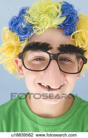 Young boy wearing clown wig and fake nose smiling View Large Photo Image Stock Image - Young boy wearing clown wig and fake nose smiling. Fotosearch