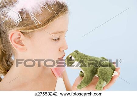 Young girl in princess costume kissing plush frog View Large Photo Image Stock Image - Young girl in princess costume kissing plush frog. Fotosearch