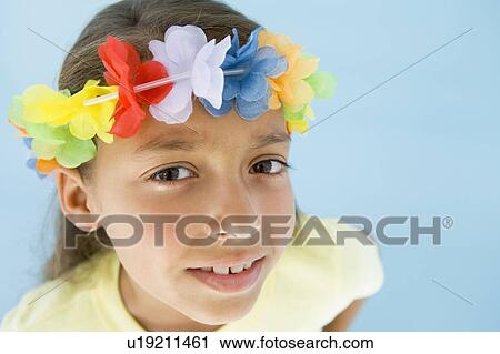Young girl wearing garland on head View Large Photo Image Stock Image - Young girl wearing garland on head. Fotosearch
