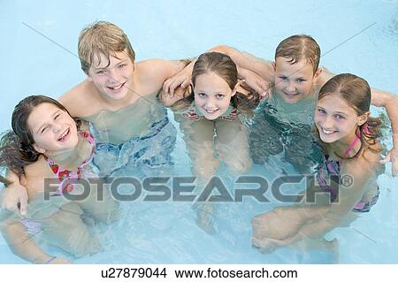 Picture - Five young friends in swimming pool smiling. Fotosearch