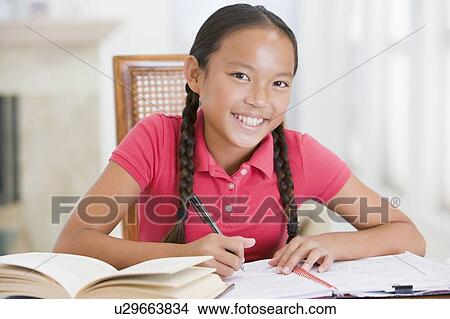 Picture - Girl Doing Her Homework. Fotosearch
