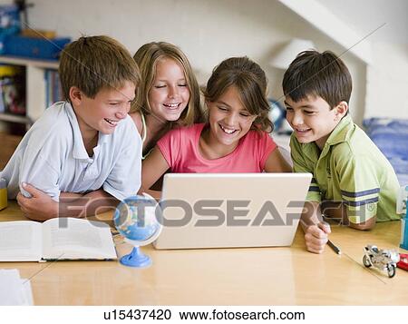 Group Of Young Children Doing Their Homework On A Laptop View Large Photo Image Stock Image - Group Of Young Children Doing Their Homework On A Laptop. Fotosearch