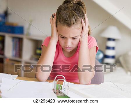Young Girl Doing Her Homework With Her Head In Her Hands View Large Photo Image Stock Image - Young Girl Doing Her Homework With Her Head In Her Hands. Fotosearch