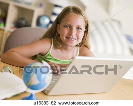 Young Girl Doing Homework On A Laptop View Large Photo Image Stock Image - Young Girl Doing Homework On A Laptop. Fotosearch