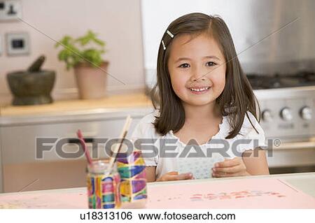 Stock Photograph - Young Girl Drawing Pictures. Fotosearch