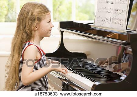 Young Girl Playing Piano View Large Photo Image Stock Image - Young Girl Playing Piano. Fotosearch