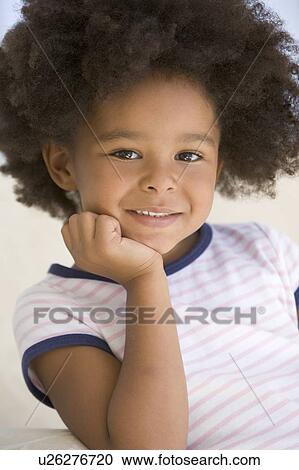 Young Girl Sitting On A Sofa View Large Photo Image Stock Image - Young Girl Sitting On A Sofa. Fotosearch