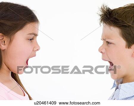 Stock Photo - Brother and sister looking at each other shouting. Fotosearch