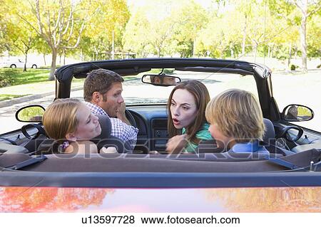 Stock Photo - Family in convertible car arguing. Fotosearch
