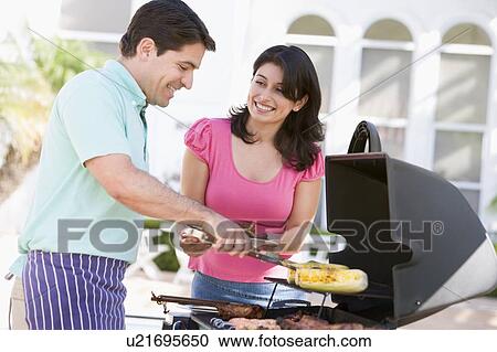 Couple Cooking On A Barbeque View Large Photo Image Stock Image - Couple Cooking On A Barbeque. Fotosearch