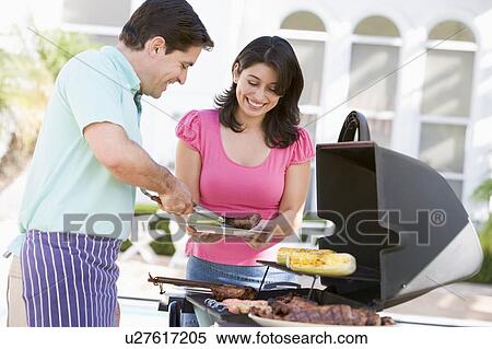 Couple Cooking On A Barbeque View Large Photo Image Stock Photography - Couple Cooking On A Barbeque. Fotosearch
