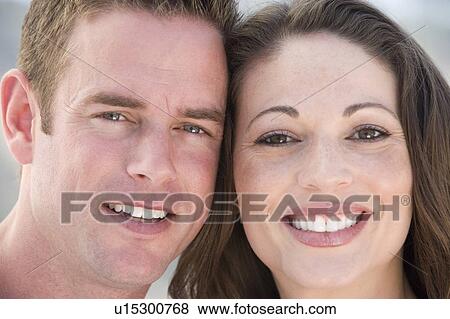 Stock Photo - Couple outdoors smiling. Fotosearch