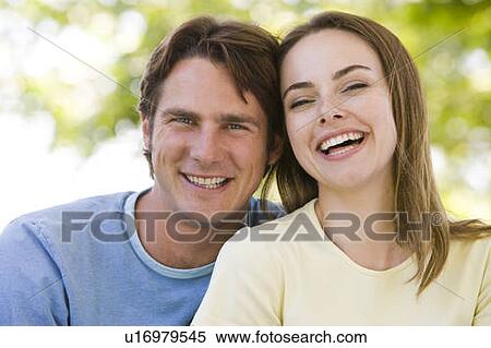 Stock Photography - Couple outdoors smiling. Fotosearch