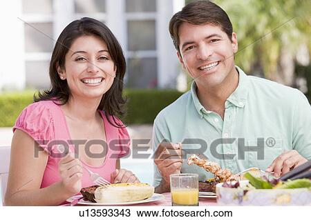 Family Enjoying A Barbeque View Large Photo Image Stock Image - Family Enjoying A Barbeque. Fotosearch