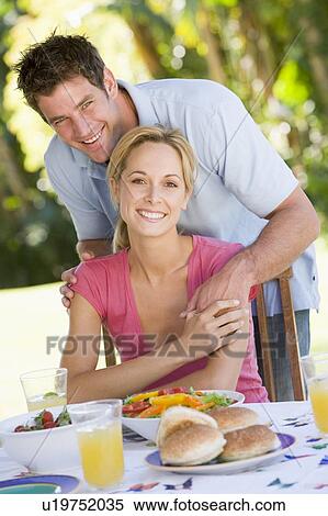 Stock Photography - Family Enjoying A Barbeque. Fotosearch