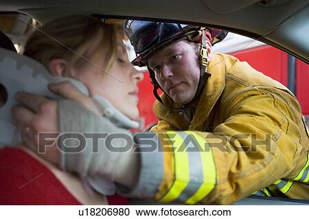 Fireman helping woman with neck brace (selective focus) View Large Photo Image Stock Image - Fireman helping woman with neck brace (selective focus). Fotosearch