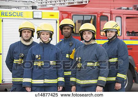 Five firefighters standing by fire engine wearing helmets View Large Photo Image Stock Photography - Five firefighters standing by fire engine wearing helmets. Fotosearch
