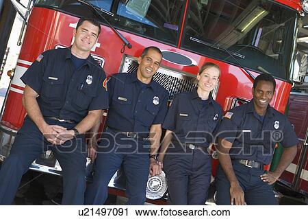 Four firefighters leaning on fire engine View Large Photo Image Stock Image - Four firefighters leaning on fire engine. Fotosearch