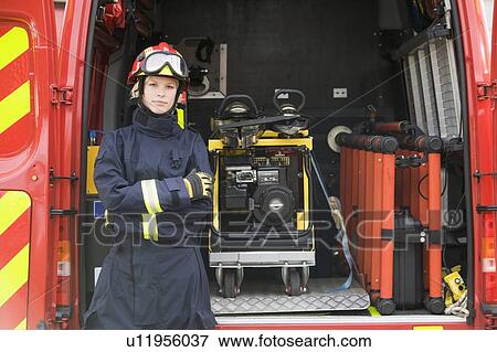 Rescue worker standing by open back door of rescue vehicle View Large Photo Image Stock Photo - Rescue worker standing by open back door of rescue vehicle. Fotosearch