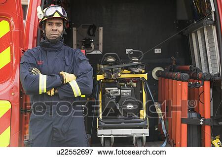 Rescue worker standing by open back door of rescue vehicle View Large Photo Image Stock Photo - Rescue worker standing by open back door of rescue vehicle. Fotosearch