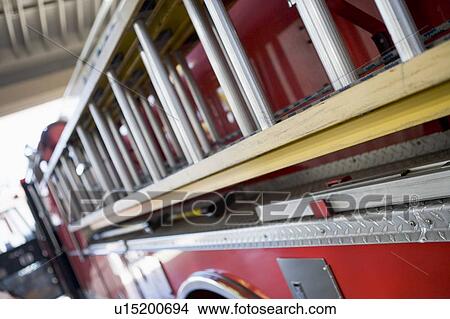Shot of a fire engine with ladder (depth of field) View Large Photo Image Picture - Shot of a fire engine with ladder (depth of field). Fotosearch