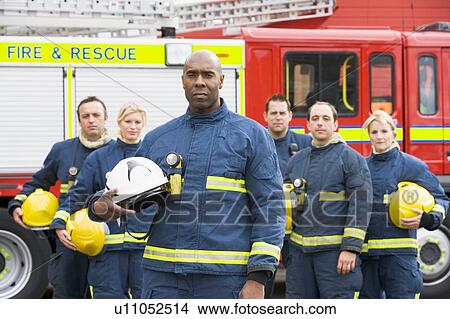 Six firefighters standing by fire engine View Large Photo Image Picture - Six firefighters standing by fire engine. Fotosearch
